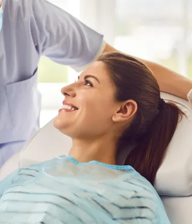 Patient smiling during a dental visit